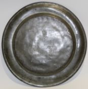 Pewter plate incised with initials and the date 1764 with various maker's marks to base, 22cm diam