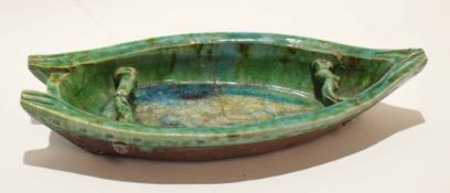 Pottery model of a boat, probably Oriental, with a green glaze (a/f), 44cm long