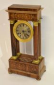 Mantel clock in neo-classical style, the dial supported by four classical columns, the frame with