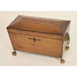 19th century mahogany sarcophagus shaped tea caddy, the interior fitted with three sliding lidded