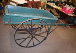 Green painted cart with cast iron spoked wheels and suspension, 230cm long