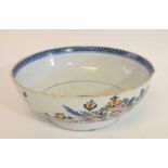 Mid-18th century London Delft punch bowl with a polychrome floral pattern (typical chips to rim