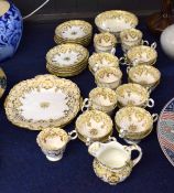 Extensive part tea set, mid-19th century, English porcelain Rockingham style, comprising 21 cups