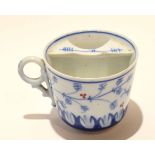 19th century blue and white moustache cup with a bird and floral design, 8cm high