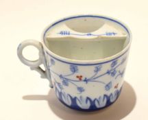 19th century blue and white moustache cup with a bird and floral design, 8cm high