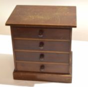 Small mahogany stained four-drawer table top specimen chest containing various British common