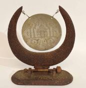 Indian or Burmese dinner gong in carved wooden frame