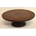 Late 19th/early 20th century mahogany lazy susan of typical circular form with spreading base,