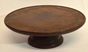 Late 19th/early 20th century mahogany lazy susan of typical circular form with spreading base,