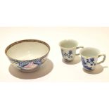 Two mid-18th century Chinese blue and white cups with twig handles (chips to rim) together with an