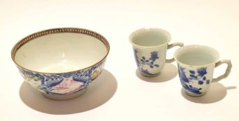 Two mid-18th century Chinese blue and white cups with twig handles (chips to rim) together with an