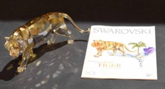 Swarovski silver crystal model of a tiger with amber colouring, complete with certificate and