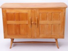 Mid-century Ercol blonde wood sideboard with two cupboards and internal drawers with central sliding