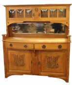 Arts & Crafts light oak dresser, two cupboards with glass panels above a mirror back, two drawers