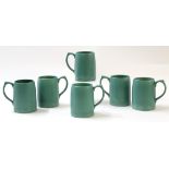 Collection of six green glazed pottery mugs designed by Keith Murray for Wedgwood, the mugs 13cm