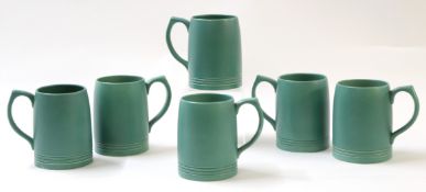 Collection of six green glazed pottery mugs designed by Keith Murray for Wedgwood, the mugs 13cm