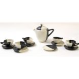 Art Deco style coffee set by Luc Vallauris, decorated in a two-tone black and white design,