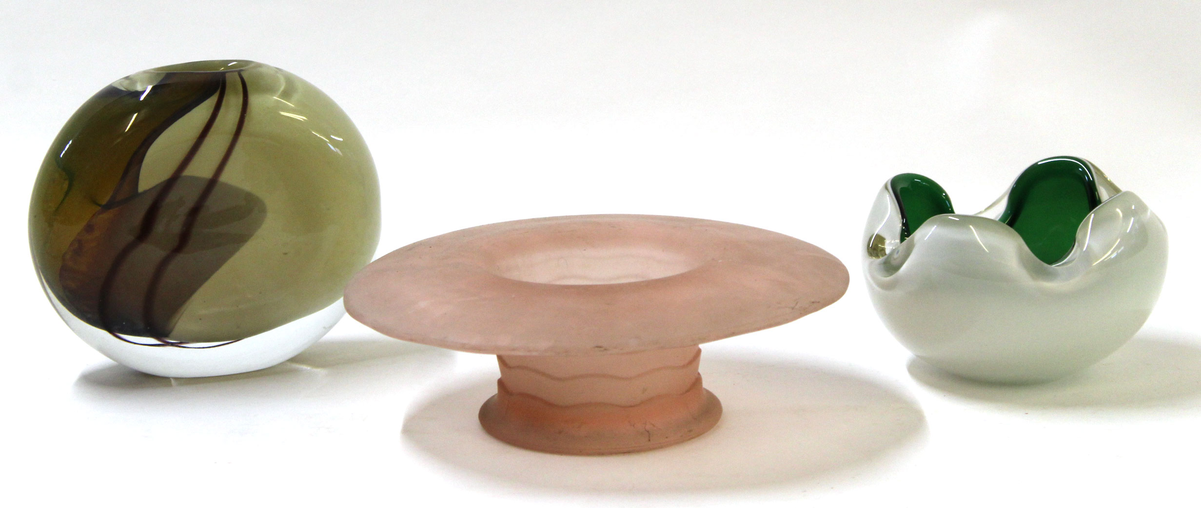 Three pieces of studio glass including a circular vase, mushroom shape, with ribbed design in pink