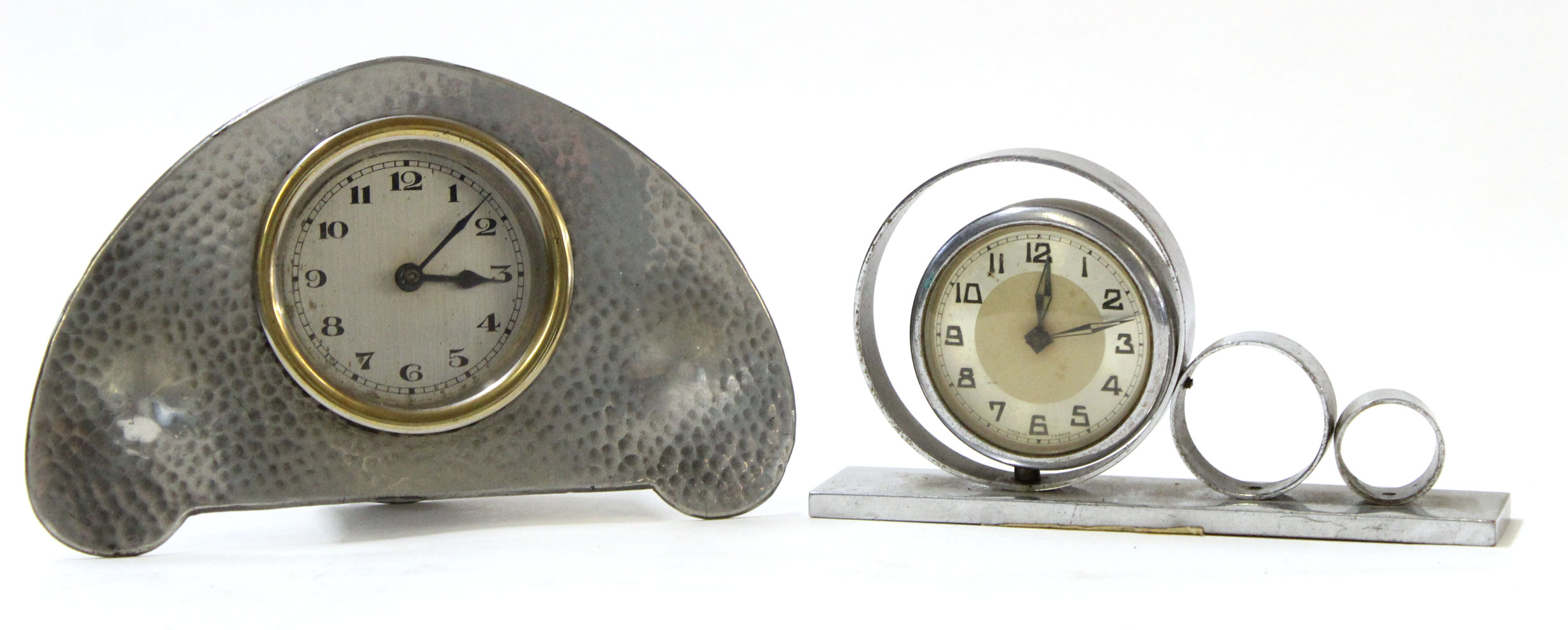 Liberty style alarm clock with hammered pewter surround, the reverse marked "L & Co Homeland No