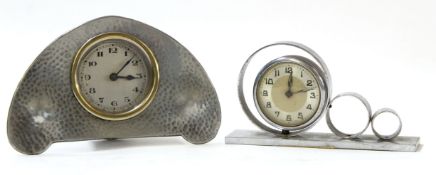 Liberty style alarm clock with hammered pewter surround, the reverse marked "L & Co Homeland No