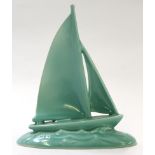 Poole Studio Pottery design of a yacht in a green glaze, the base with factory stamp and celadon,