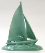 Poole Studio Pottery design of a yacht in a green glaze, the base with factory stamp and celadon,