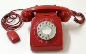 Vintage red GPO plastic telephone with rotary dial, stamped "746F.DFM" and 69/1 underneath