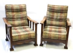 Early 20th century Arts & Crafts style pair of upholstered reclining armchairs