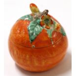 Clarice Cliff jam pot and cover, naturalistically modelled as an orange with cover, Clarice Cliff