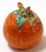 Clarice Cliff jam pot and cover, naturalistically modelled as an orange with cover, Clarice Cliff