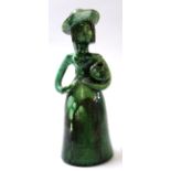 Unusual pottery sculpture of a woman with jar under her arm, green glazed with monogram JJ to