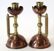 Pair of brass and copper candlesticks in Arts & Crafts style, possibly after a design by Christopher