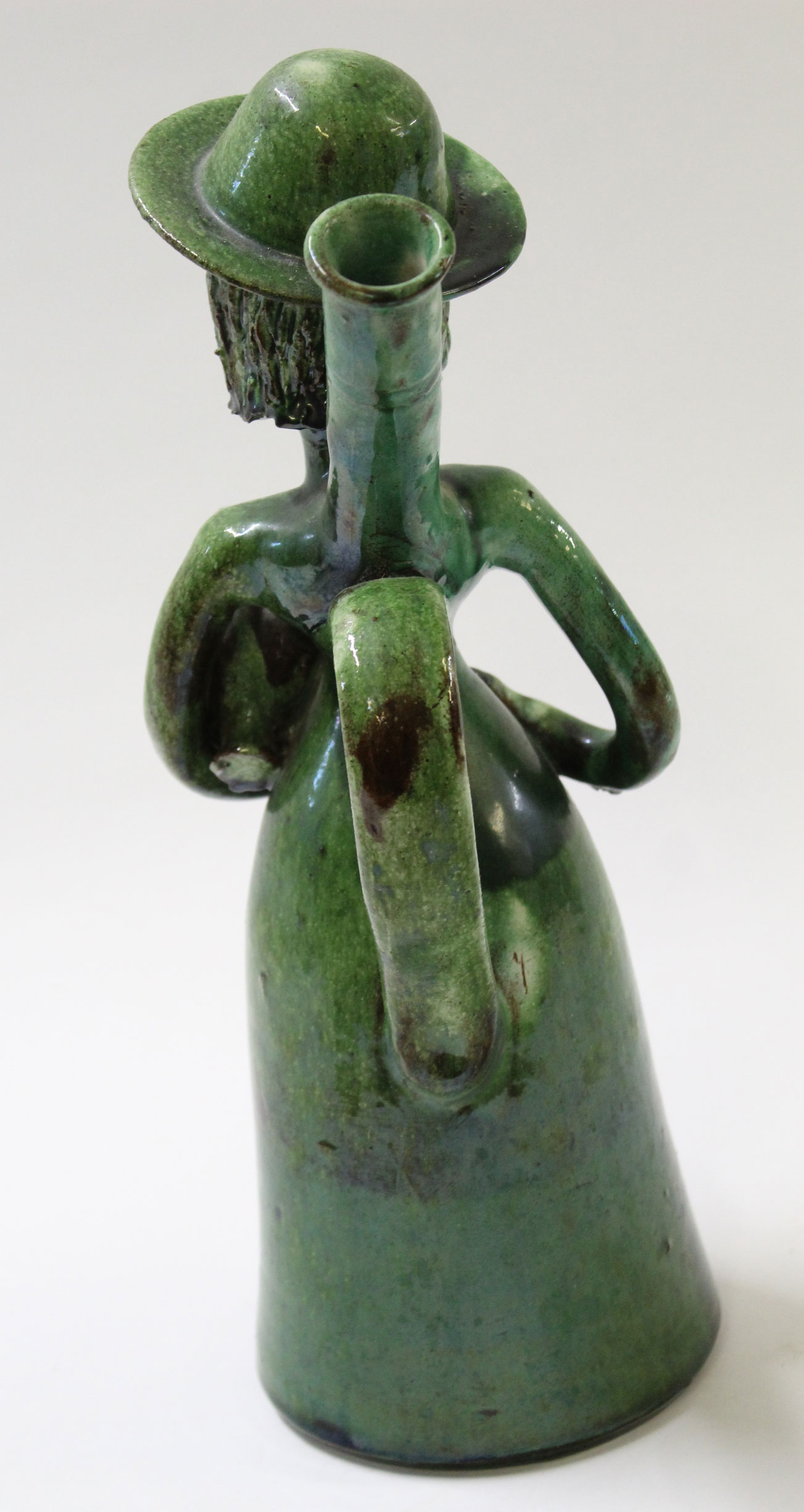 Unusual pottery sculpture of a woman with jar under her arm, green glazed with monogram JJ to - Image 3 of 5