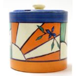 Clarice Cliff Fantasque Bizarre jam pot and cover with a sunburst type pattern with blue cover,