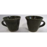 Danny Killick (b 1945), Pair of Studio Pottery cups, the ridged body with a green glazed design ,