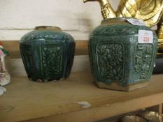 TWO ORIENTAL POTTERY VASES OF FACETED FORM WITH GREEN GLAZED PANELS WITH FLORAL DISPLAYS AND CHINESE