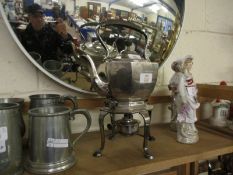 EARLY 20TH CENTURY ELECTRO-PLATED TEA KETTLE ON STAND OF FACETED AND OVAL FORM WITH HINGED COVER AND