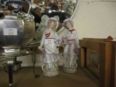 EARLY 20TH CENTURY CONTINENTAL PORCELAIN FIGURES OF A GIRL AND A BOY (2)