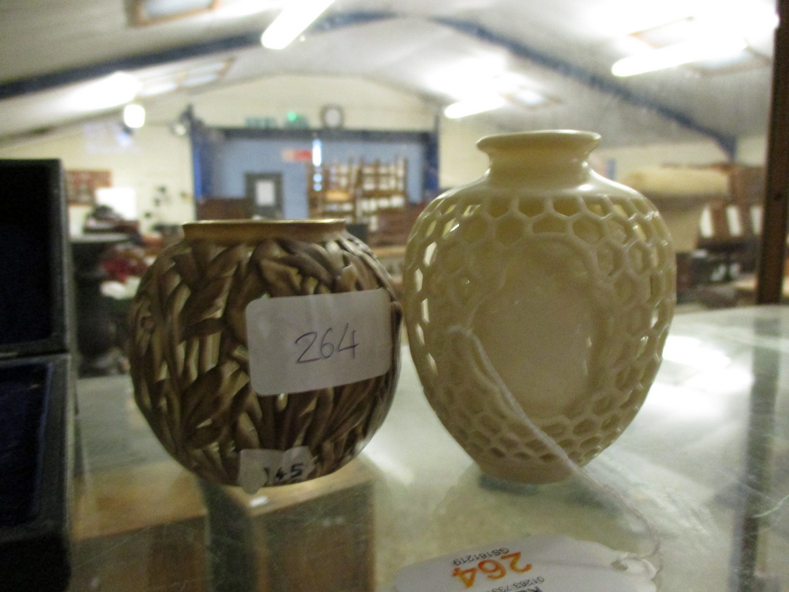 PAIR OF ROYAL WORCESTER EARLY 20TH CENTURY VASES, THE FIRST DOUBLE WALLED WITH AN OUTER