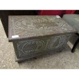 EASTERN BRASS MOUNTED SMALL PROPORTION TRUNK WITH IMPRESSED SCENES THROUGHOUT AND FITTED CANDLE BOX