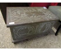 EASTERN BRASS MOUNTED SMALL PROPORTION TRUNK WITH IMPRESSED SCENES THROUGHOUT AND FITTED CANDLE BOX