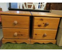 PAIR OF STAINED PINE TWO DRAWER BEDSIDE CABINETS WITH TURNED KNOB HANDLES