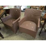 TWO RATTAN TYPE GARDEN ARMCHAIRS