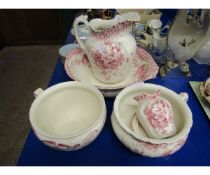 FANDON RED AND CREAM PRINTED WASH JUG AND BOWL TOGETHER WITH TWO CHAMBER POTS, BRUSH POTS, SOAP DISH