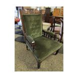 WALNUT FRAMED GREEN DRALON UPHOLSTERED AND BUTTON BACK CARVED ARMCHAIR ON RING TURNED LEGS (A/F)