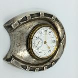 Silver horse shoe shaped clock in a case