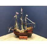 Hand crafted by a local vendor, a Galleon Ship, with wooden frame & cloth & string masts bearing