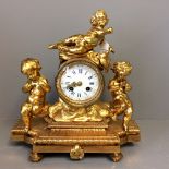 C19th French mantle clock with 8 day movement in gilded case with cherubs