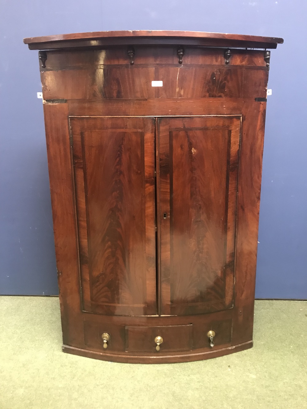 Regency crossbanded mahogany bow front corner cupboard with base drawer 90Wx48D126H cm