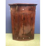 Regency crossbanded mahogany bow front corner cupboard with base drawer 90Wx48D126H cm
